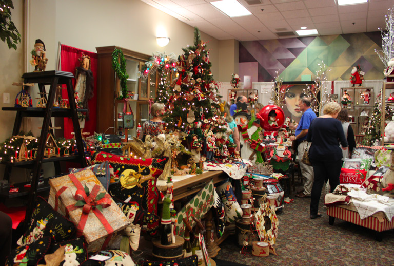 Shopper enjoy a plethora of choice art Mistletoe Market.