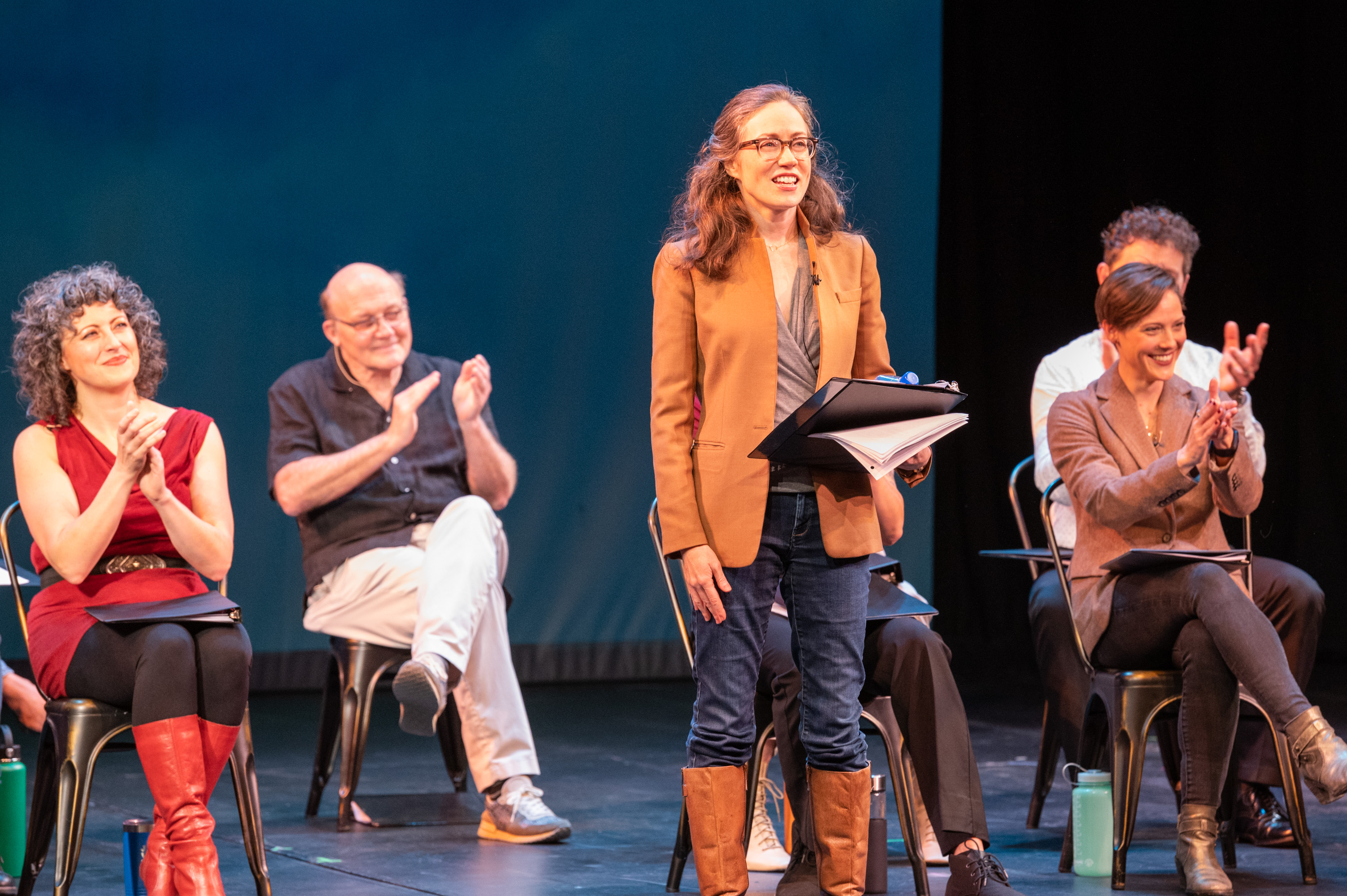 Barter Theatre actors  listen as Katy Brown (center) announces the season.