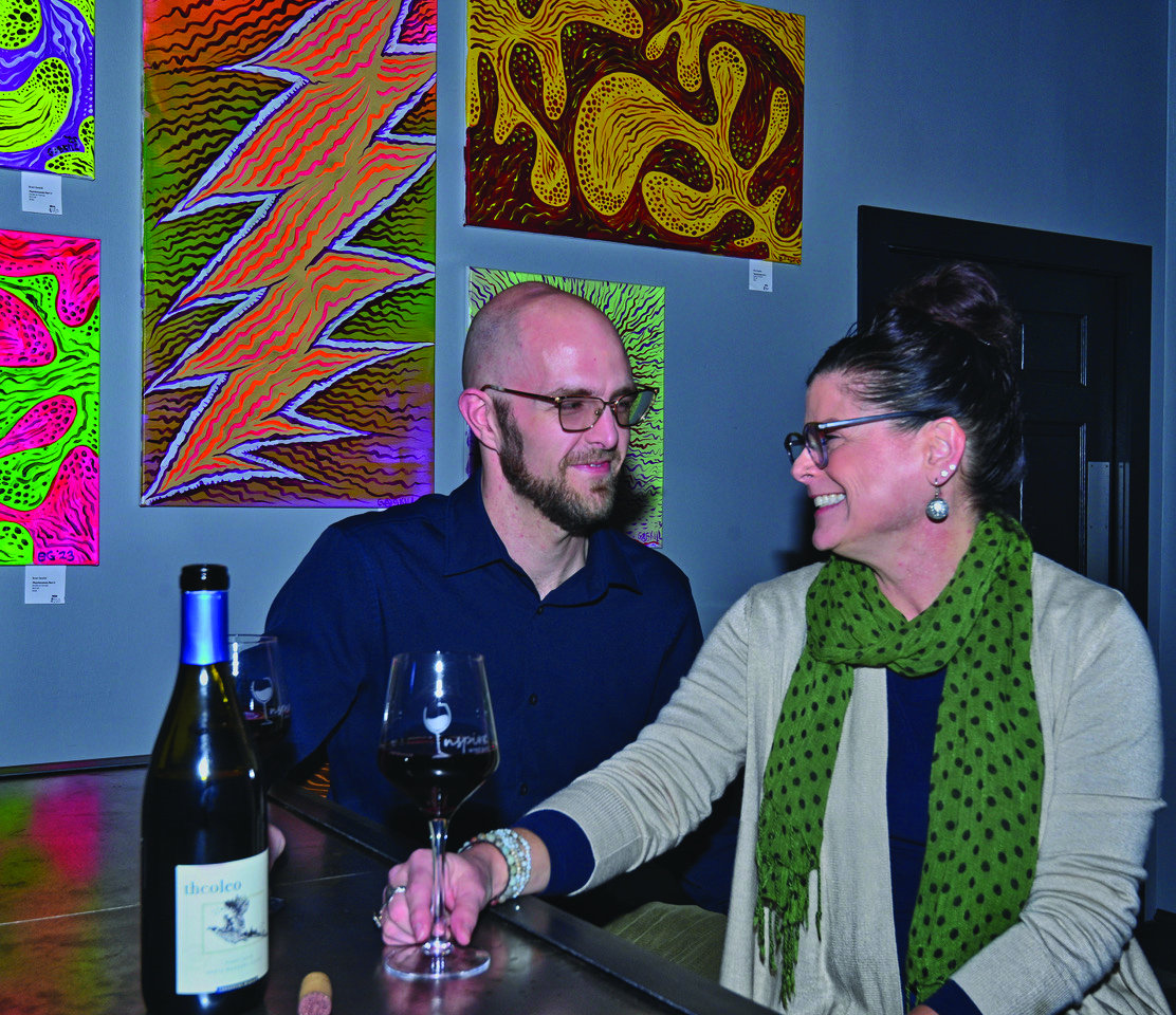 Nathan Brickey and Talina Zsido, business owners, enoy a quiet moment in their new venture, Inspire Winebar. (photo by David Grace)