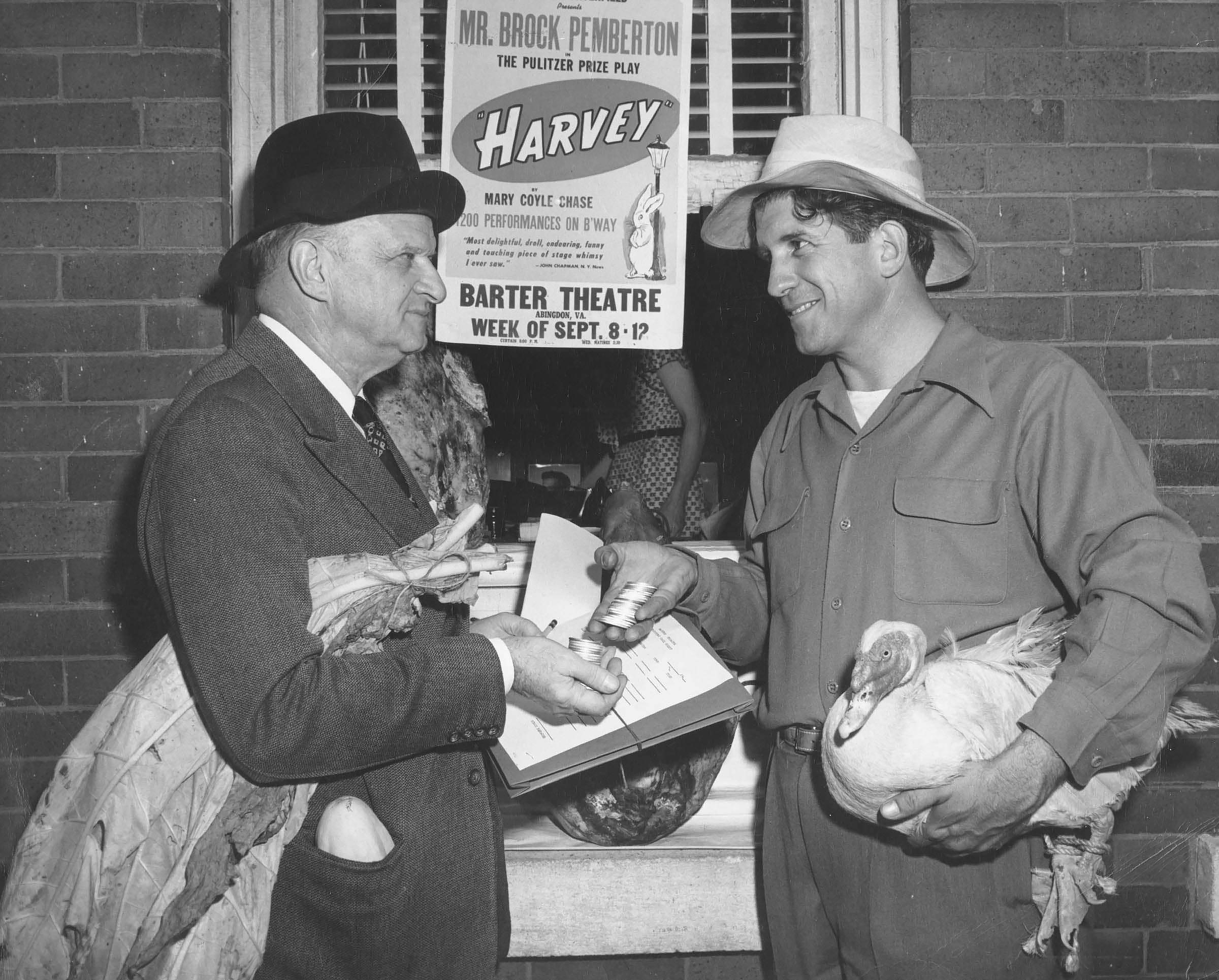 Barter Theatre Founder Robert Porterfield barters with a patron for a ticket to a performance.