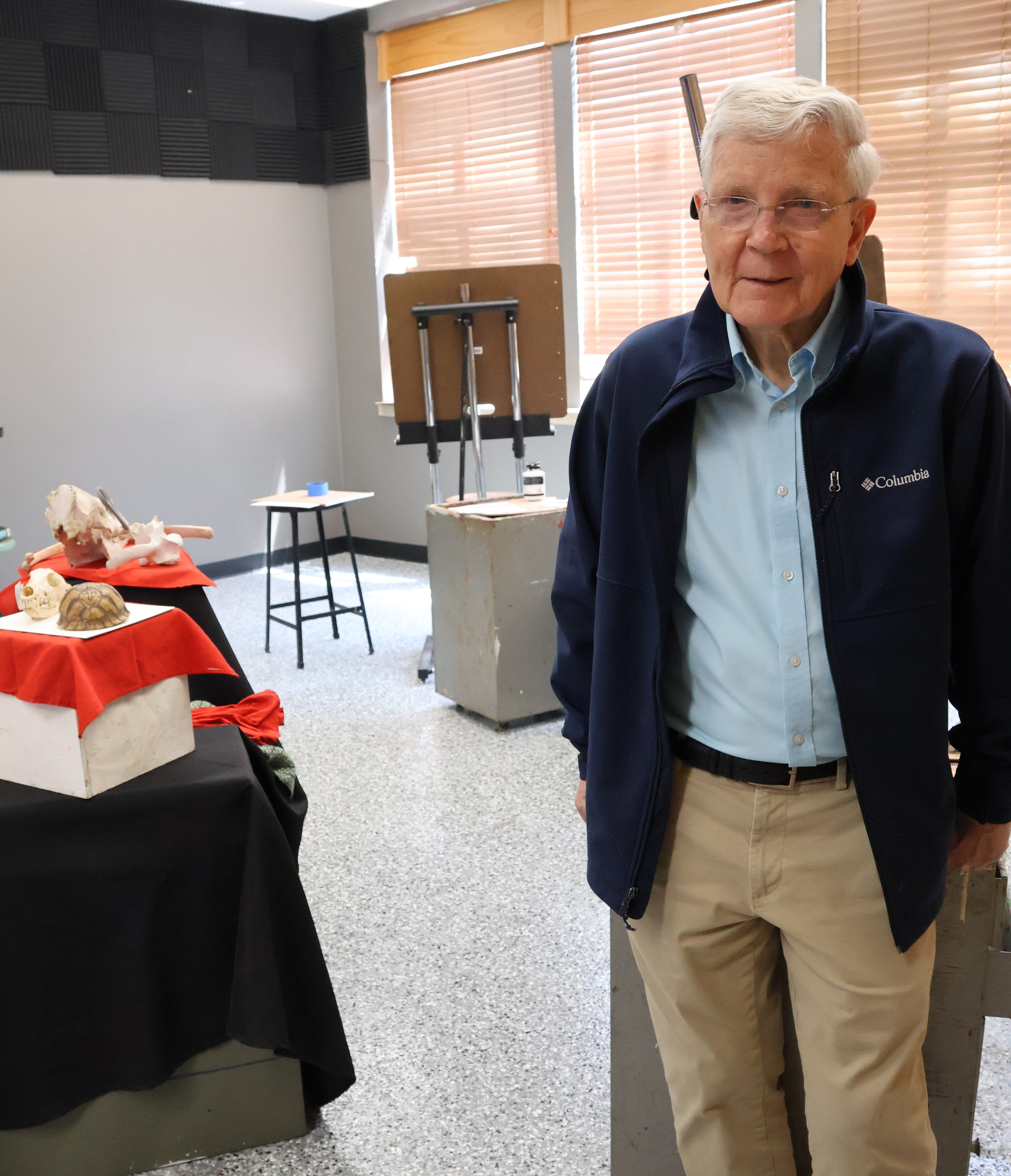 Clem Allison stands in the two-dimensional studio art laboratory.